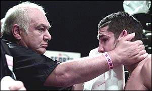 Darkie Smith holds his son Stephen's face in his hands