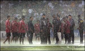 Colombo groundstaff toil under heavy rain