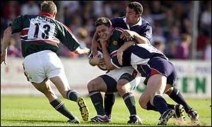 Rod Kafer is wrapped up by Daryl Gibson and Ben Sturnham