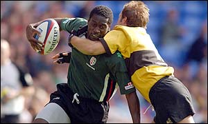 Paul Sackey is tackled by Wasps' Paul Sampson