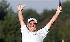 Paul McGinley raises his arms in triumph after winning the Ryder Cup