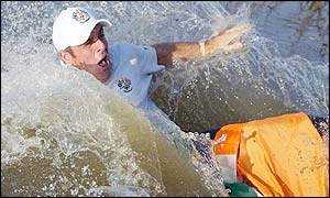 Paul McGinley flounders in a nearby lake by the Europe team in celebration