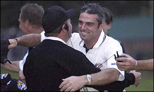 Europe vice-captain Ian Woosnam hugs Paul McGinley