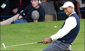 Tiger Woods misses a putt on the 16th hole