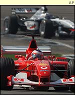 Rubens Barrichello is tracked by David Coulthard during the US Grand Prix