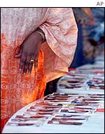 Photos of the dead laid out on tables