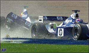Ralf Schumacher and Juan Pablo Montoya crash on the second lap