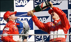 Rubens Barrichello and Michael Scumacher celebrate their success