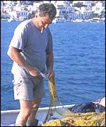 Greek fisherman smoking while working
