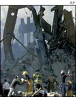 Firefighters search the rubble of the World Trade Center on 13 September 2001.