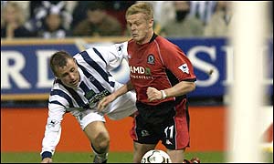 Damien Duff is pulled back by Ronnie Wallwork, although first contact appears to be outside the penalty area