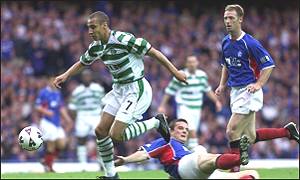 Henrik Larsson skips past Barry Ferguson
