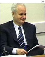 Milosevic listening to Mesic testimony