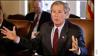 President Bush holds hands apart AFP