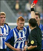 Zecke is sent off by the referee after a head butt