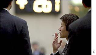 Japanese businessman smoking a cigarette