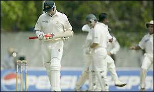 Matthew Hayden walks as he becomes Waqar Younis' first wicket of the series
