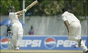 Ricky Ponting smashes a four off the bowling of Abdur Razzaq