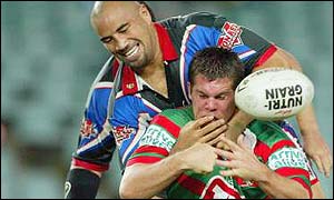 Brent Grose is tackled by Jerry Seu Seu of the NZ Warriors.