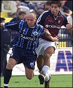 Pablo Counago, right, of Ipswich Town tries to stop Sartid's Boris Vaskovic 