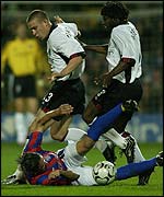 Dario Srna comes off worst under pressure from Sean Davis and Rufus Brevett