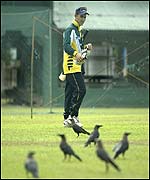 Justin Langer heads for the nets