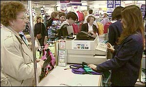 Shoppers at till in Littlewoods 
