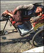 A rickshaw wallah asleep in Delhi