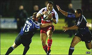 Tanner Vili is stopped by Glasgow's Gordon Bulloch