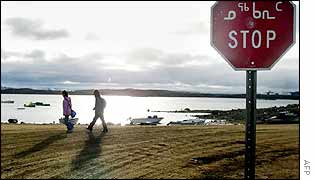 Two Inuit children return from school