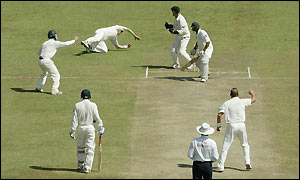 Shane Warne claims his second wicket with the removal of Faisal Iqbal