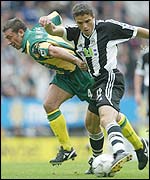 Laurent Robert holds off Derek MacInnes