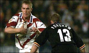 Anthony Stewart of St Helens takes on Bradford's Mike Forshaw 