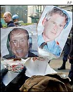 Burning effigies of Silvio Berlusconi and George W Bush in Milan