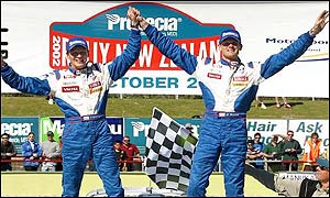 Gronholm celebrates snatching the title from Britain's Richard Burns