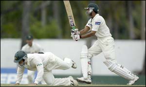 Younis Khan of Pakistan hits the ball past Justin Langer 32