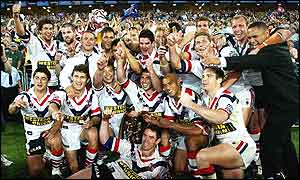 The Roosters pose with the NRL Grand Final trophy