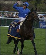 Frankie Dettori celebrates his Arc win on Marienbard