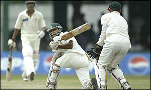 Pakistan's Faisal Iqbal hits outs against Australia