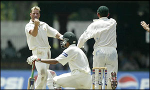 Shane Warne celebrates taking Younis Khan's wicket