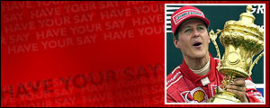 Michael Schumacher holds the trophy aloft after winning the 2002 British Grand Prix at Silverstone