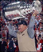 Detroit coach Scotty Bowman holds up the Stanley Cup