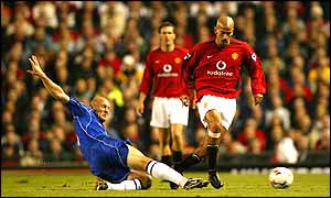 Thomas Gravesen slides in to thwart Juan Sebastian Veron