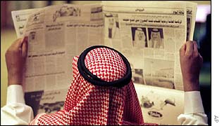 Saudi man reads newspaper