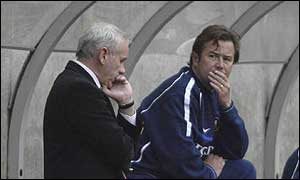Peter Reid (left) and Adrian Heath feel the strain on the Sunderland bench.