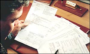 BT customers reading bills 