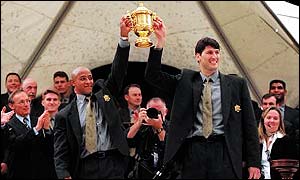 George Gregan (left) and John Eales parade the William Webb-Ellis trophy in Sydney