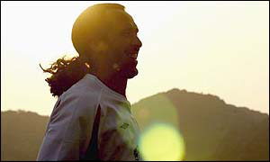 David Seaman smiles with the sun setting behind him