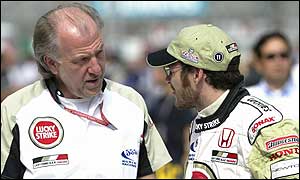 BAR team boss David Richards (left) talks to driver Jacques Villeneuve