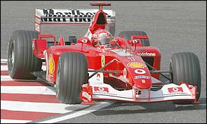 Michael Schumacher in the Ferrari round a tough bend